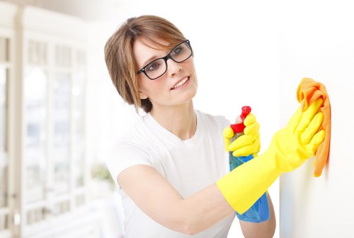 Technician removing stains from a sofa in Edmonton