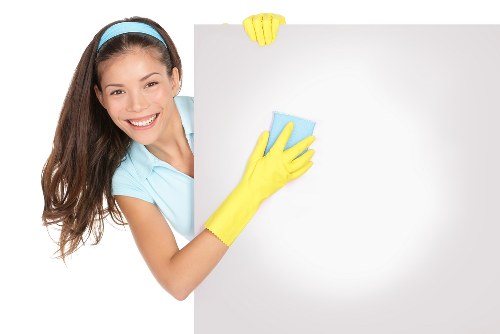 Technician using protective equipment during a carpet cleaning job